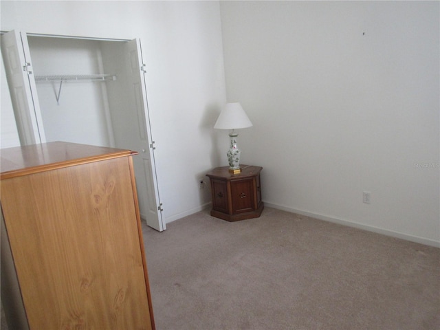 2459 NW 55th Avenue Rd, Ocala, FL 34482 - unfurnished bedroom with a closet, light colored carpet, and baseboards