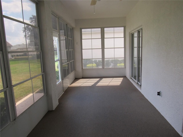 2459 NW 55th Avenue Rd, Ocala, FL 34482 - unfurnished sunroom featuring ceiling fan