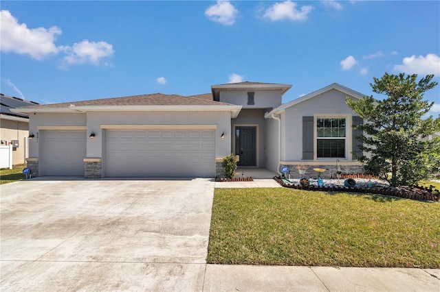 view of front of home featuring a garage, stone siding, stucco siding, and a front yard