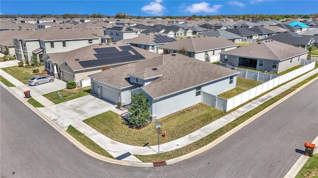 birds eye view of property with a residential view