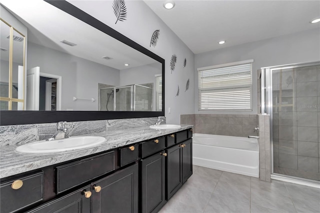 full bathroom with a stall shower, tile patterned flooring, a sink, and visible vents