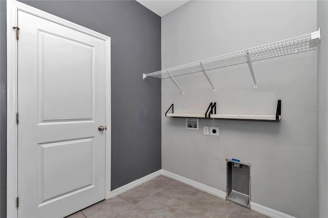 laundry area featuring light tile patterned floors, hookup for a washing machine, hookup for an electric dryer, laundry area, and baseboards