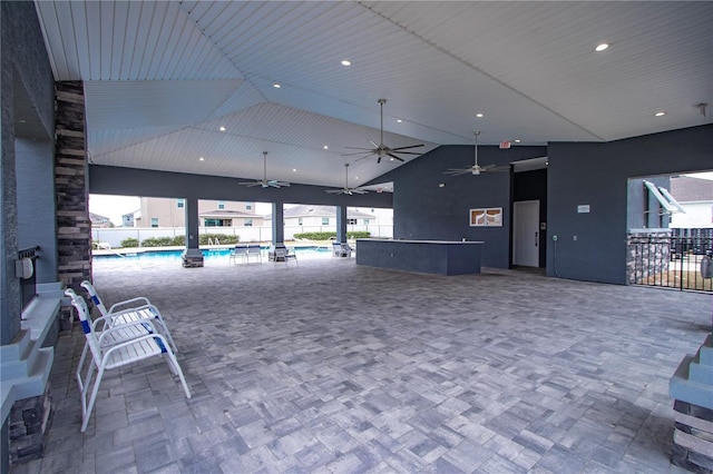 interior space featuring high vaulted ceiling and recessed lighting