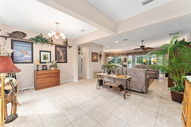 living room with light tile patterned floors, baseboards, visible vents, and ceiling fan with notable chandelier