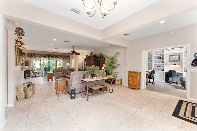 living area featuring recessed lighting, visible vents, light tile patterned flooring, baseboards, and ceiling fan with notable chandelier