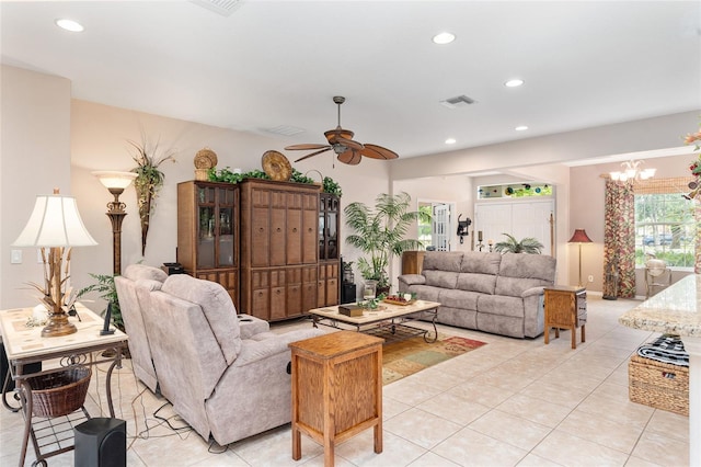 living room with ceiling fan with notable chandelier, light tile patterned flooring, visible vents, and recessed lighting