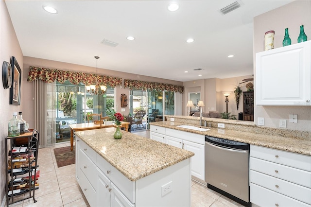 kitchen featuring visible vents, dishwasher, a kitchen island, a sink, and recessed lighting