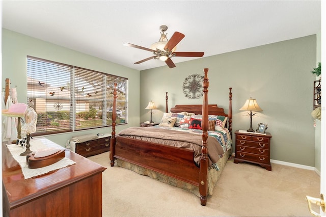 bedroom featuring baseboards, a ceiling fan, and carpet flooring