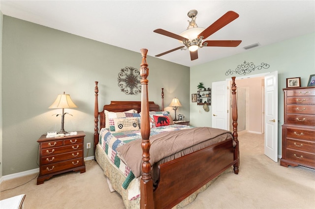 carpeted bedroom with baseboards, visible vents, and a ceiling fan