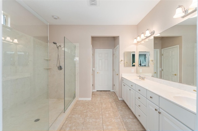 full bathroom featuring visible vents, walk in shower, and a sink