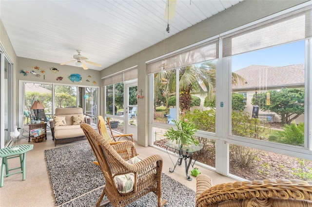 sunroom featuring a ceiling fan