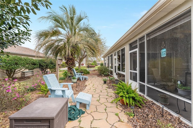 view of patio / terrace with a sunroom