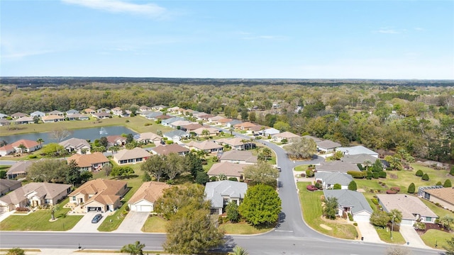 drone / aerial view with a water view and a residential view