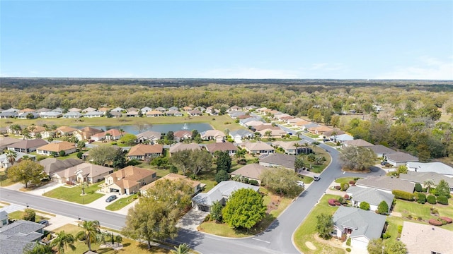 birds eye view of property featuring a water view and a residential view