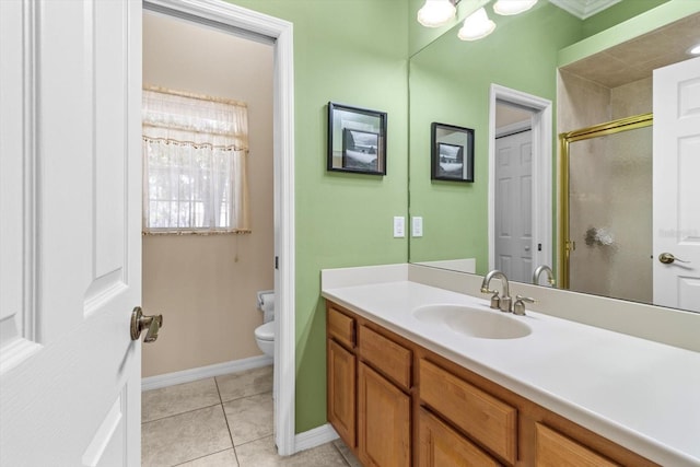 bathroom featuring a stall shower, baseboards, toilet, tile patterned flooring, and vanity