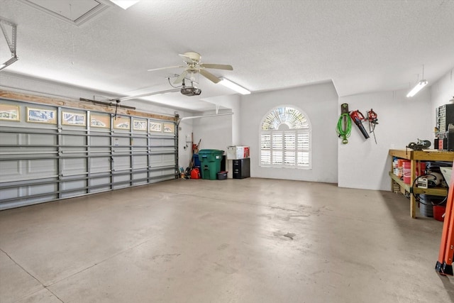 garage featuring a ceiling fan and a garage door opener