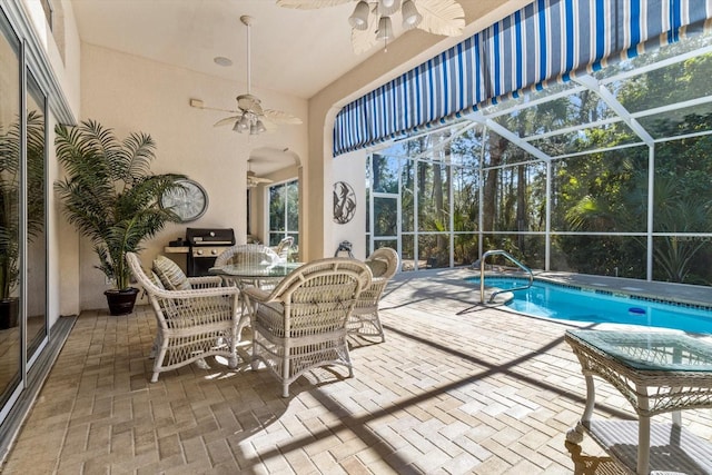 sunroom / solarium with ceiling fan