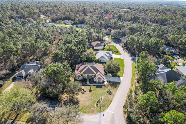 aerial view with a residential view and a wooded view