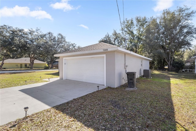 detached garage featuring cooling unit