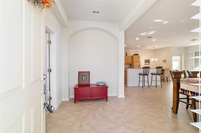 foyer entrance with recessed lighting, visible vents, baseboards, and light tile patterned flooring