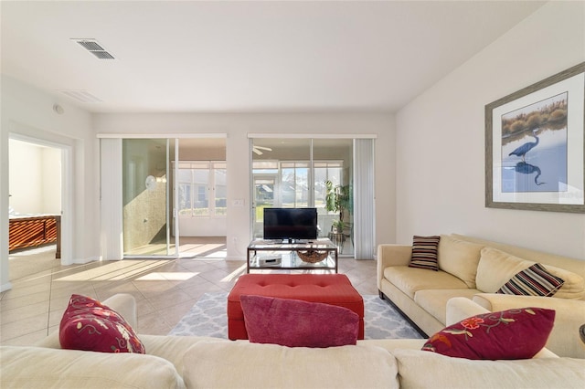 living area featuring visible vents and tile patterned floors