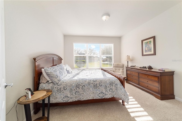 carpeted bedroom featuring baseboards