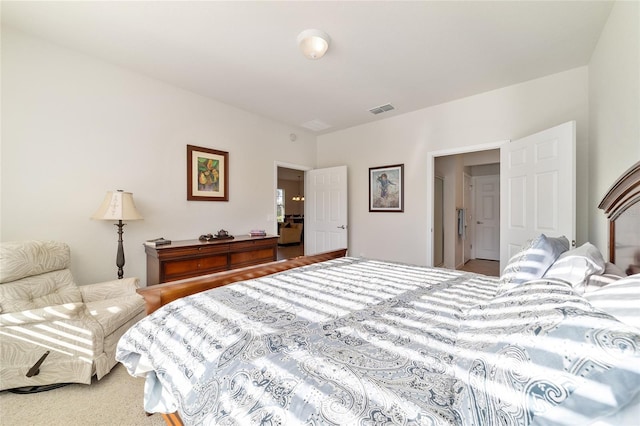 bedroom featuring visible vents