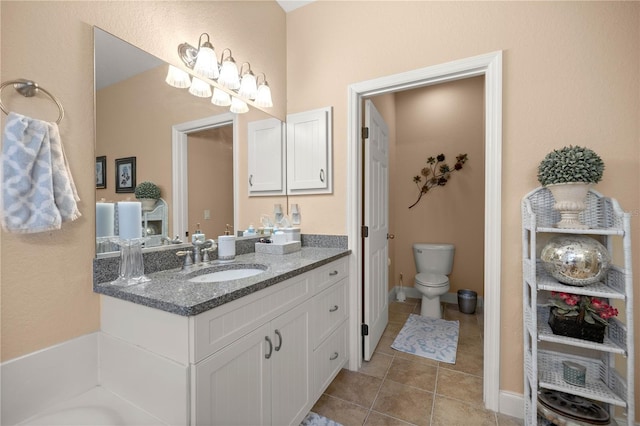 full bathroom featuring vanity, tile patterned flooring, and toilet