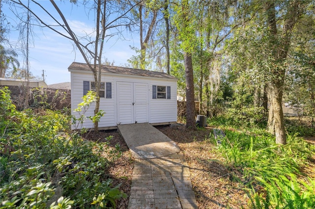 view of shed with fence