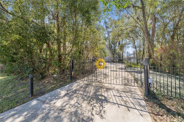 view of gate featuring fence