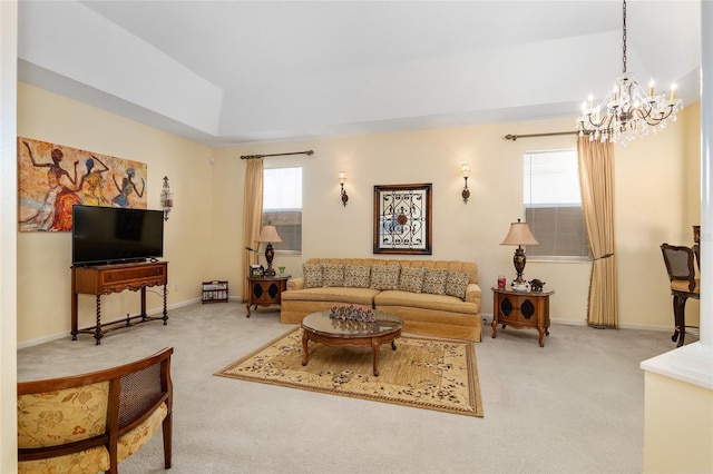 living room with carpet floors, baseboards, and an inviting chandelier