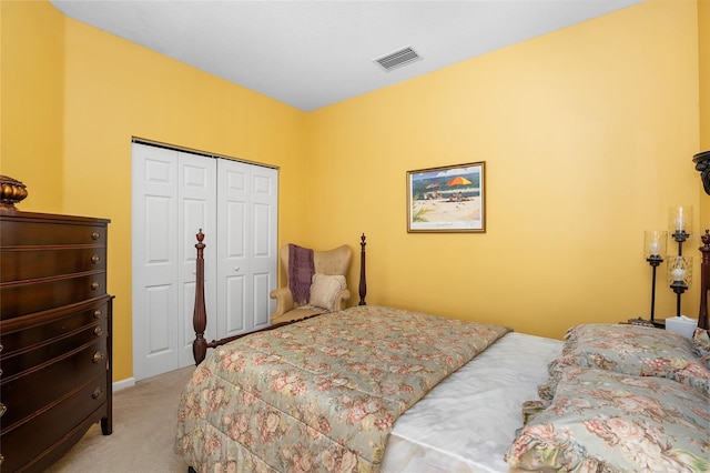 bedroom featuring light colored carpet, a closet, and visible vents