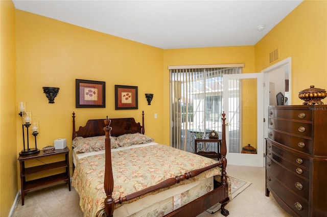 bedroom featuring access to exterior, visible vents, and light colored carpet