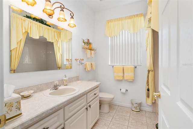 full bath with toilet, tile patterned flooring, vanity, and baseboards