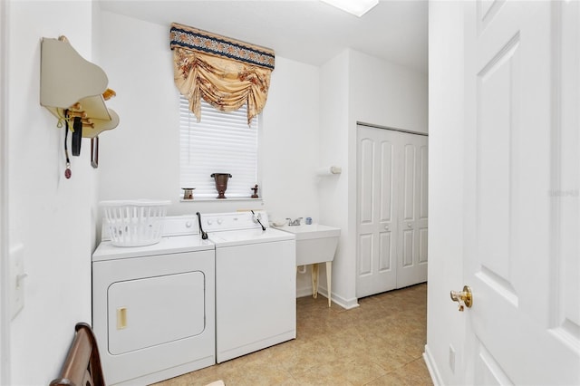 laundry area featuring laundry area, independent washer and dryer, and baseboards