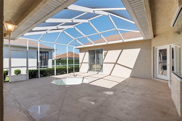 view of patio / terrace with a lanai