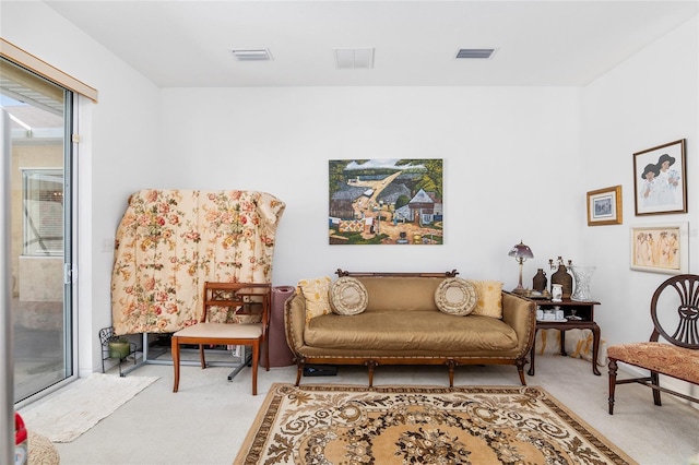 sitting room with carpet and visible vents