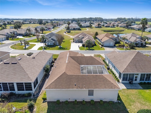 birds eye view of property with a residential view