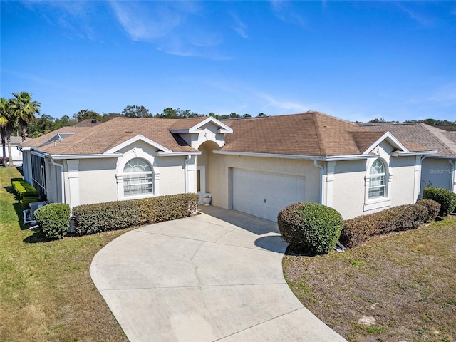5891 NW 26th St, Ocala, FL 34482 - view of front of property with stucco siding, a garage, driveway, a front yard, and roof with shingles