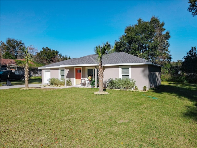 ranch-style home featuring a garage, roof with shingles, a front yard, and stucco siding