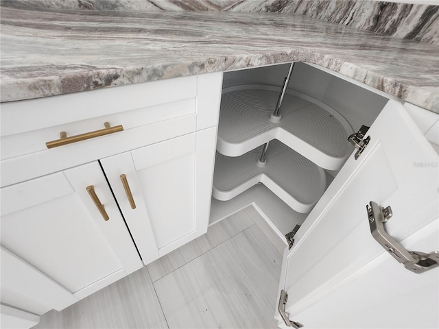 room details featuring light countertops and white cabinets