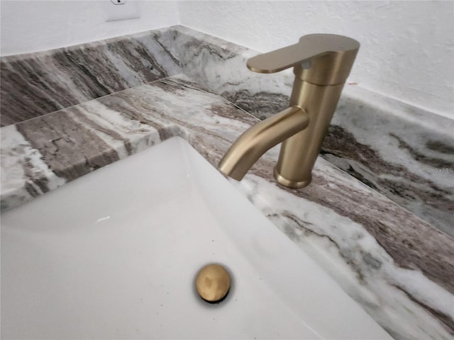 interior details featuring a sink
