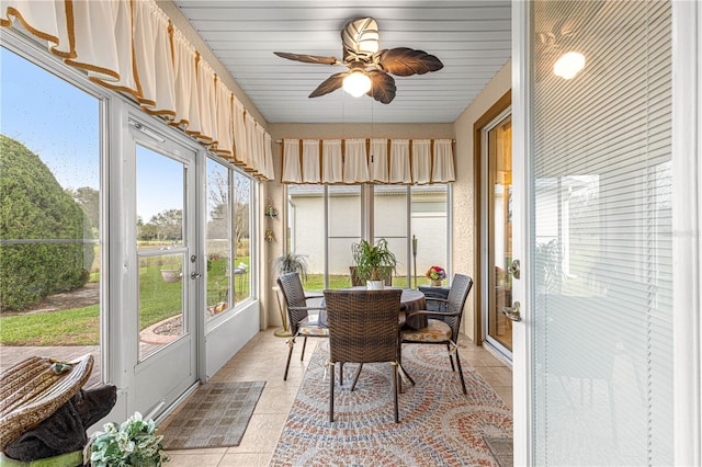 sunroom with a ceiling fan