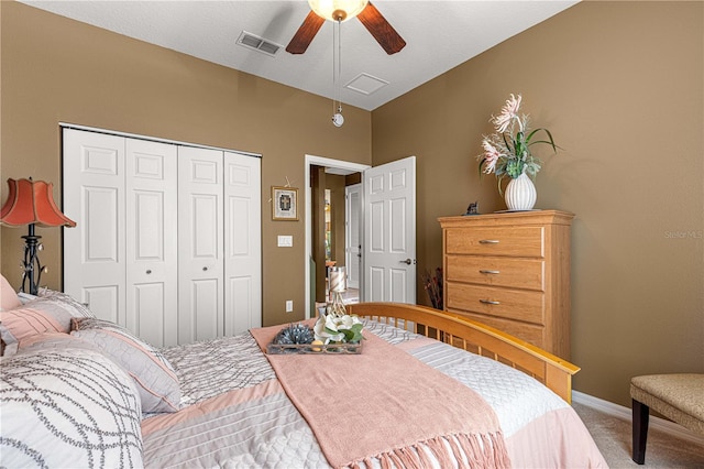 bedroom with carpet flooring, visible vents, baseboards, a ceiling fan, and a closet