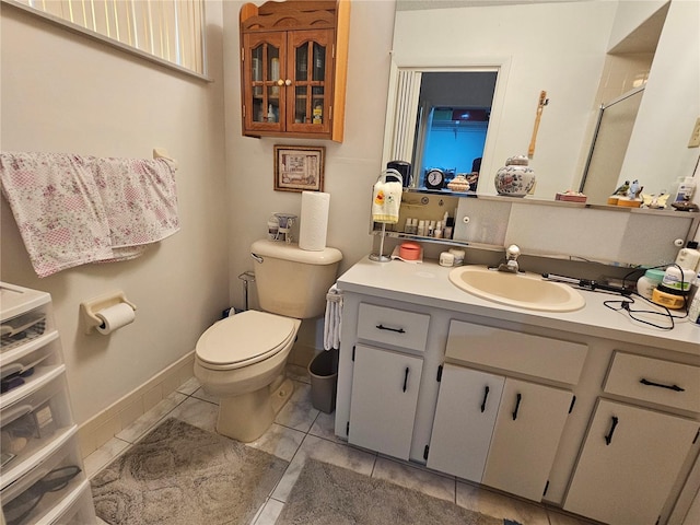 bathroom with vanity, toilet, and an enclosed shower