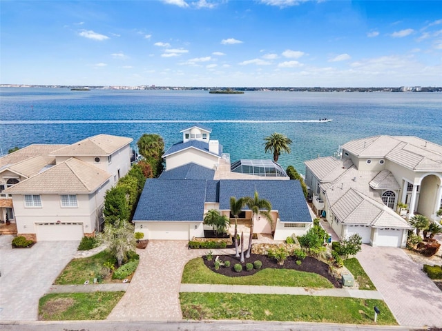 aerial view with a water view and a residential view