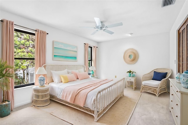 bedroom featuring a closet, visible vents, and a ceiling fan