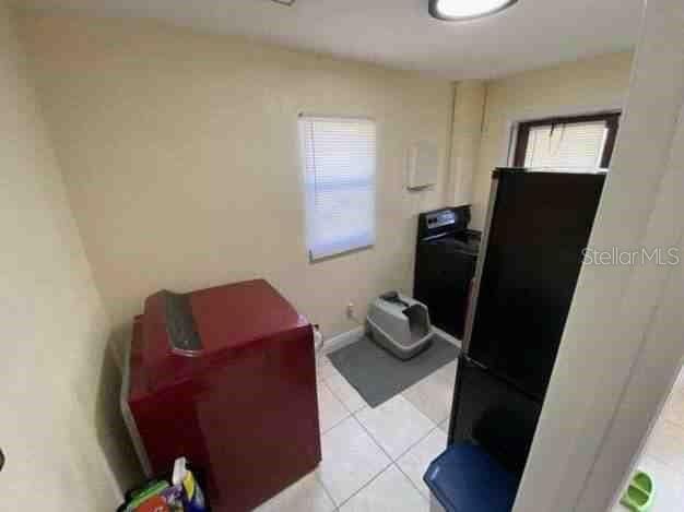 interior space featuring light tile patterned floors