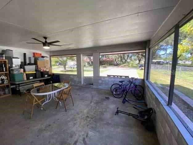 sunroom with a ceiling fan