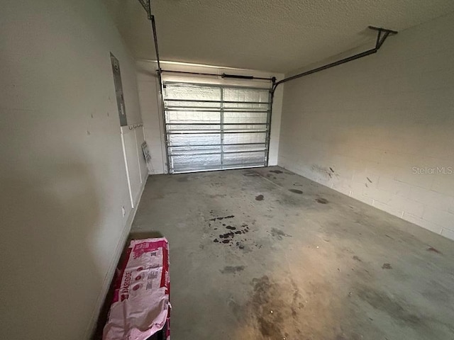 garage featuring concrete block wall